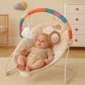 Baby relaxing in Jumini bouncer chair with soft plush materials